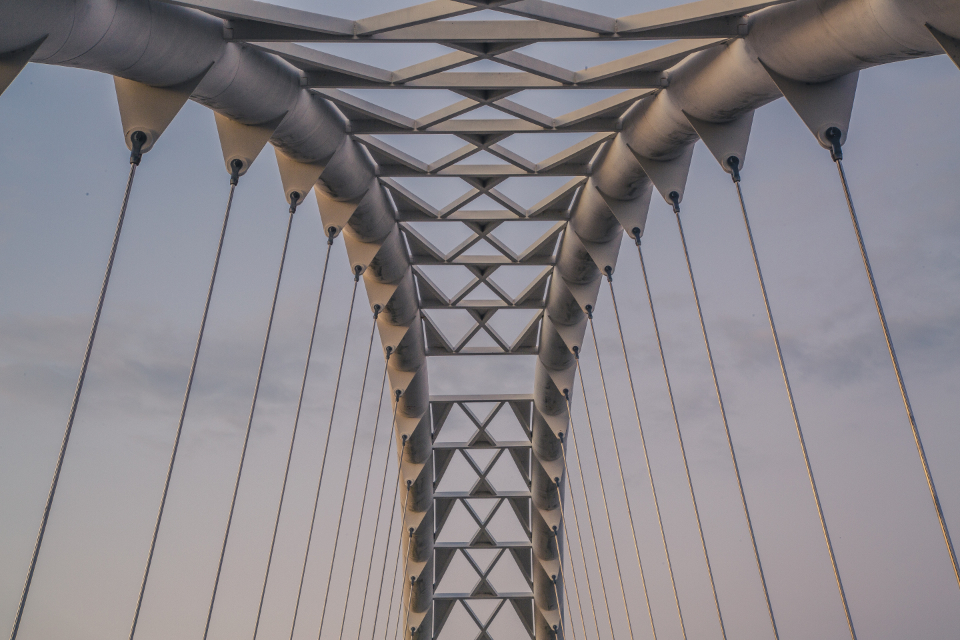 The symmetrical steel structure of a modern bridge